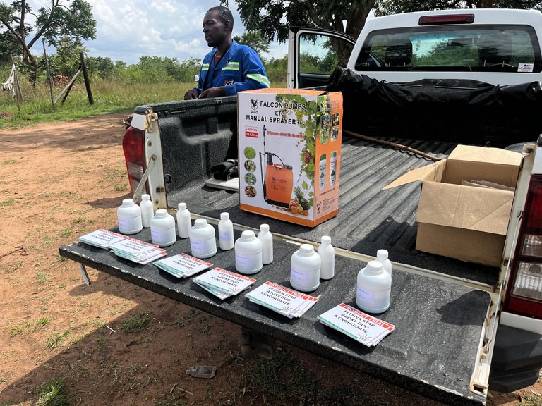 Knapsacks, signs and chemicals laid out for the growers